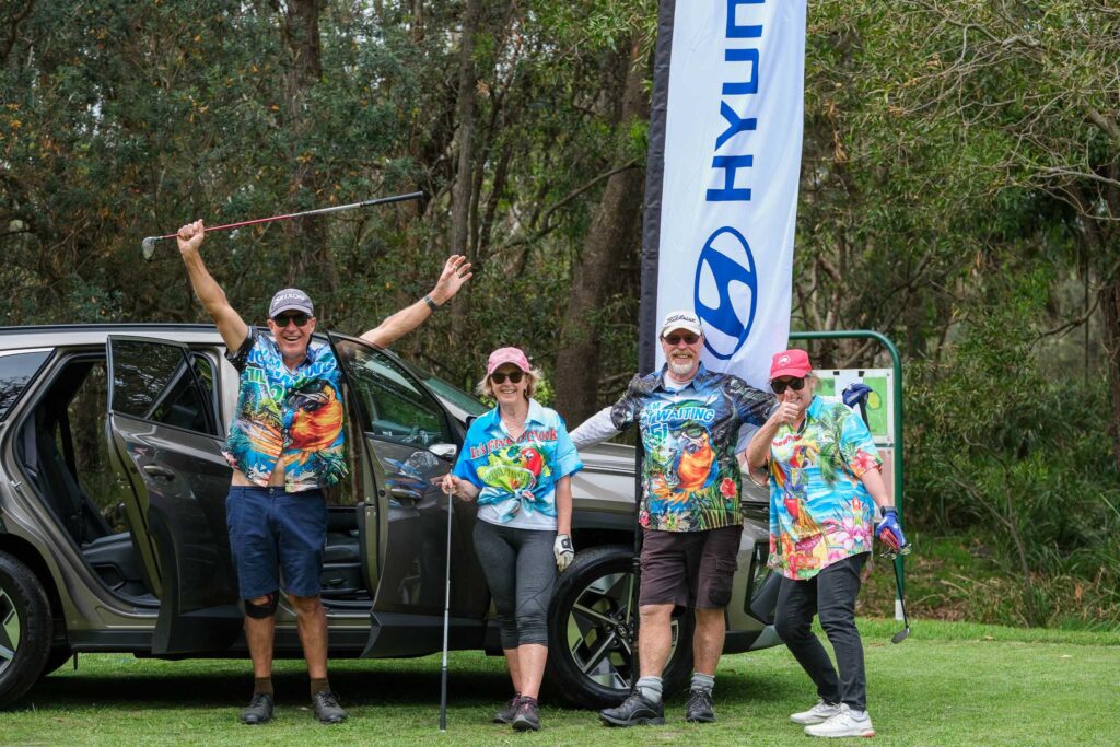 participants posing with Hyundai car